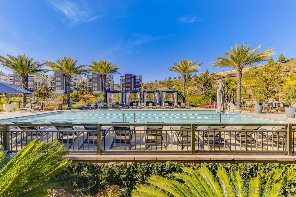 7832 Inception Way San Diego, CA 92108 - Photo 27 of 31 a view of a swimming pool with a table and chairs