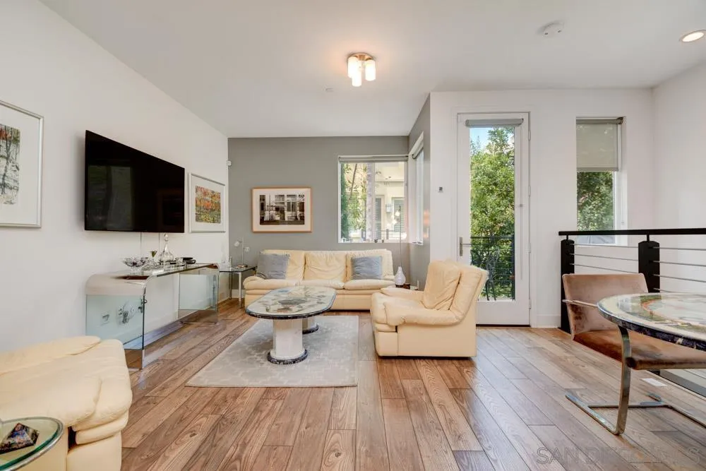7832 Inception Way San Diego, CA 92108 - Photo 3 of 31 a living room with furniture and a flat screen tv