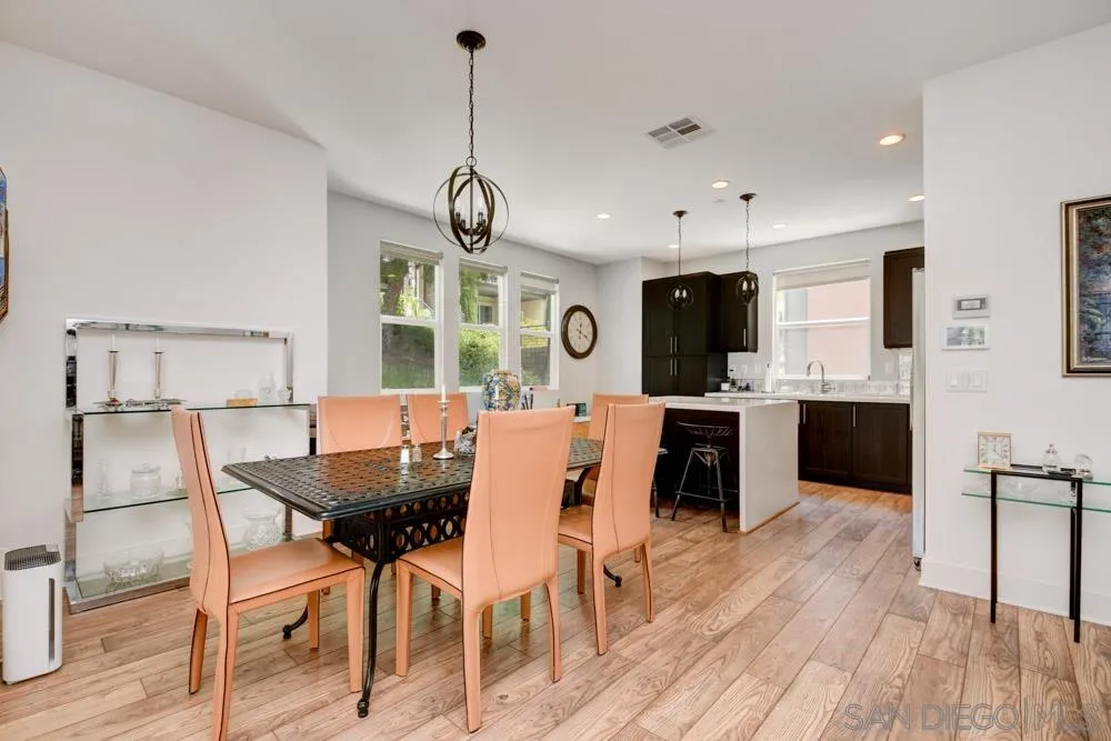 7832 Inception Way San Diego, CA 92108 - Photo 6 of 31 a view of kitchen with cabinets table and chairs