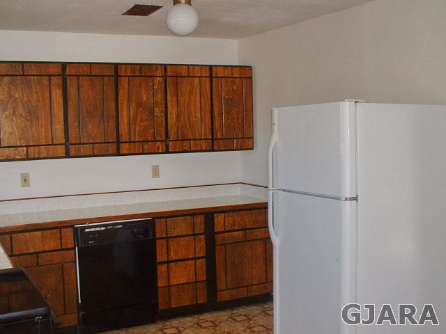 833 21 Road Fruita, CO 81521 - Photo 4 of 8 a view of storage and utility room with washer and dryer