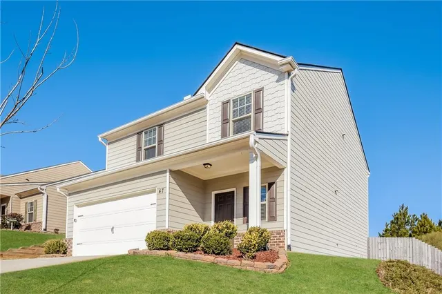 a view of a house with a yard