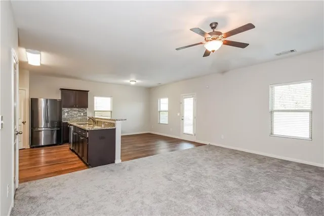 a view of a kitchen with a sink and microwave