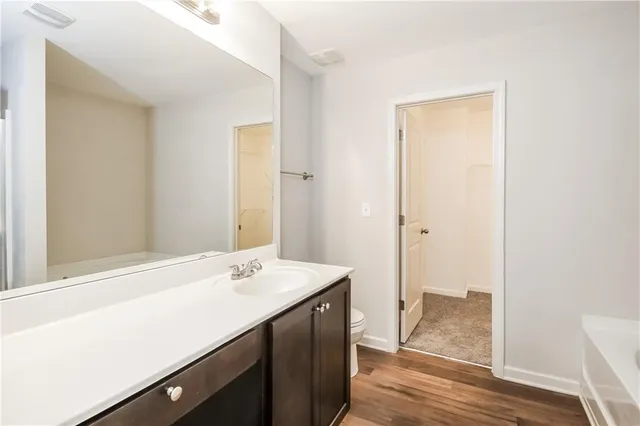 a bathroom with a sink a mirror and a shower