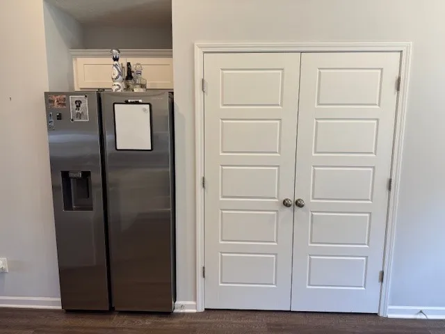 a view of storage and utility room with closet