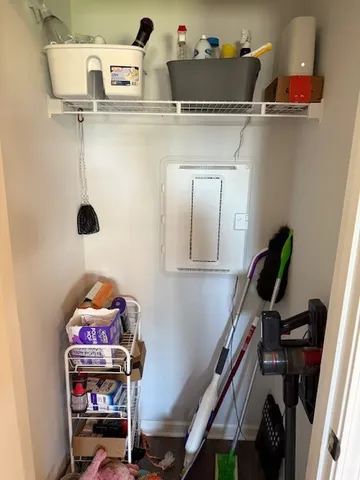 a bathroom with a sink and wooden floor