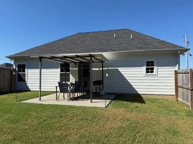 a view of a chairs and tables in the backyard