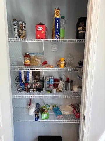 a bedroom with a bed and a flat tv screen