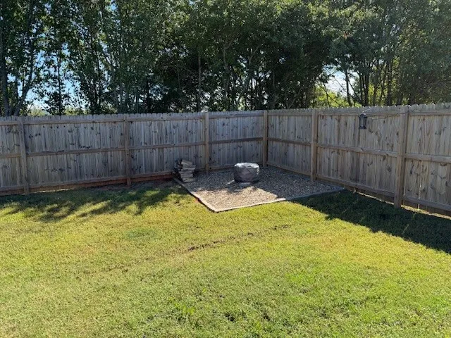 a bathroom with a shower and a sink