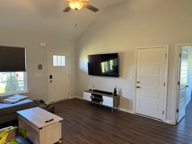 a living room with furniture and a flat screen tv