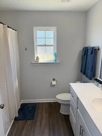 a bathroom with a toilet and a sink
