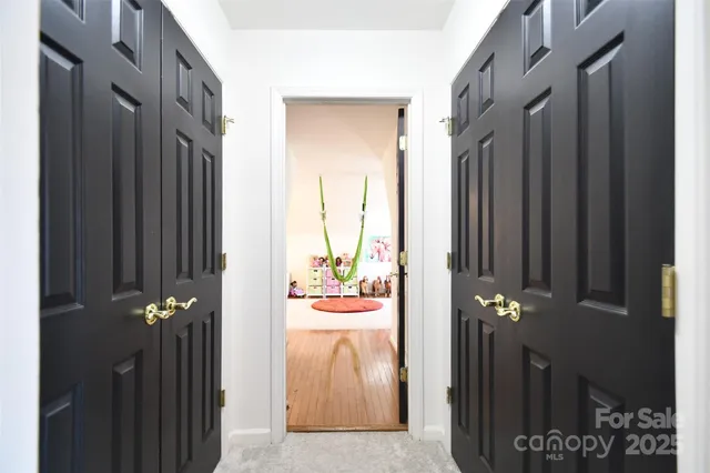 a view of a balcony with wooden floor door and stairs