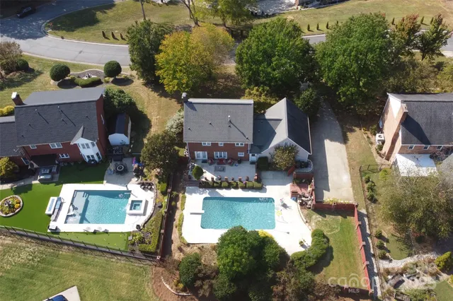an aerial view of a house with a garden