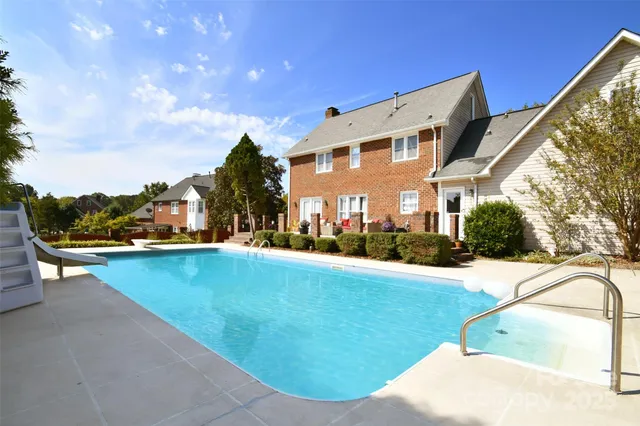 a view of a swimming pool with a lounge chairs