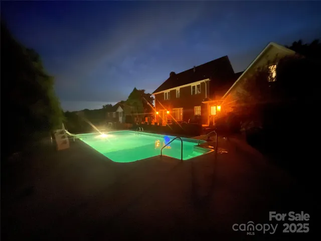 a view of swimming pool from a yard