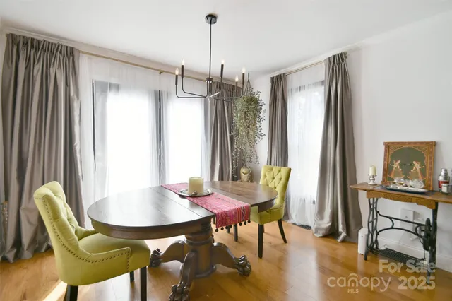 a view of a dining room with furniture and window