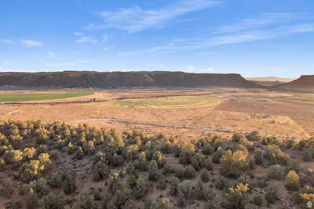 Gooseberry Way Apple Valley, UT 84737 - Photo 22 of 24 Expansive desert landscape featuring natural scrub brush and distant mesa formations