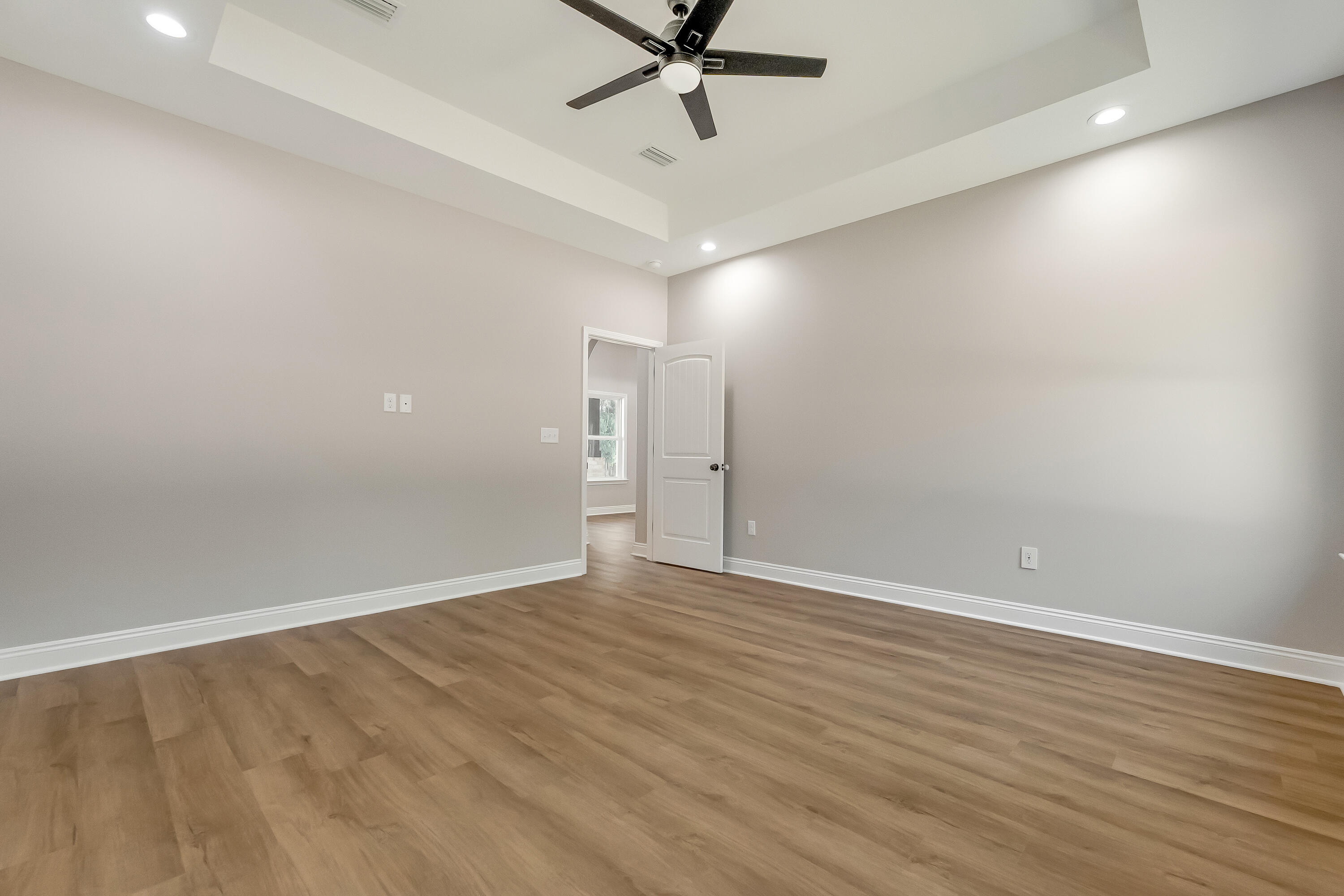 2.93-ac Goodwin Road Crestview, FL 32539 - Photo 24 of 45 wooden floor in an empty room with a window