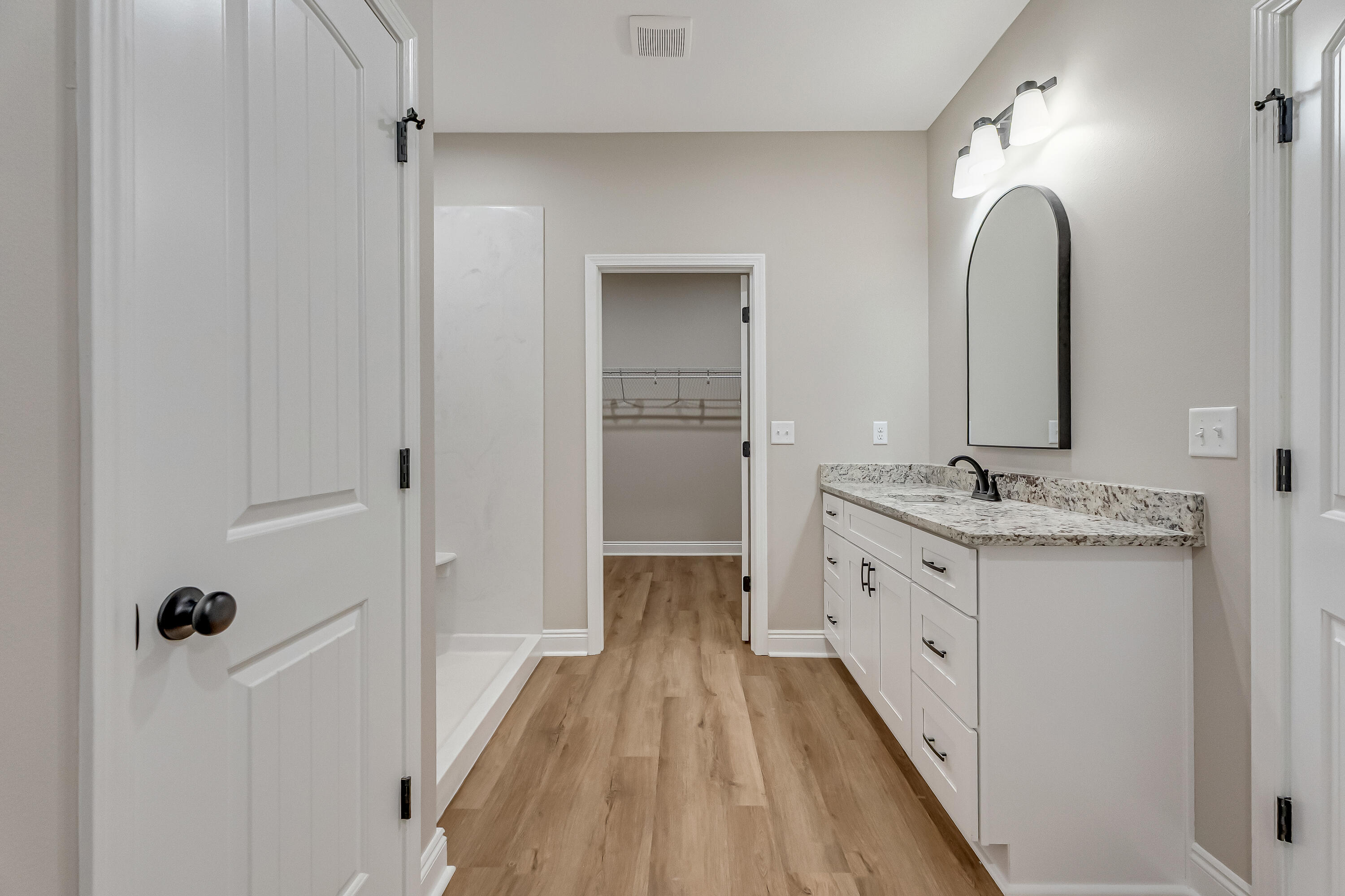 2.93-ac Goodwin Road Crestview, FL 32539 - Photo 27 of 45 a spacious bathroom with a double vanity sink and a mirror