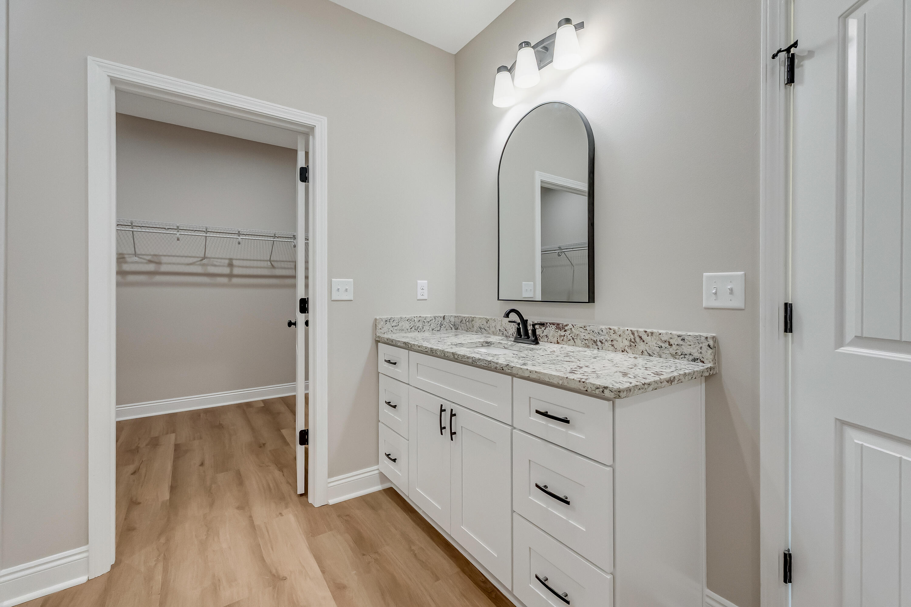 2.93-ac Goodwin Road Crestview, FL 32539 - Photo 29 of 45 a bathroom with a granite countertop sink a mirror and a vanity