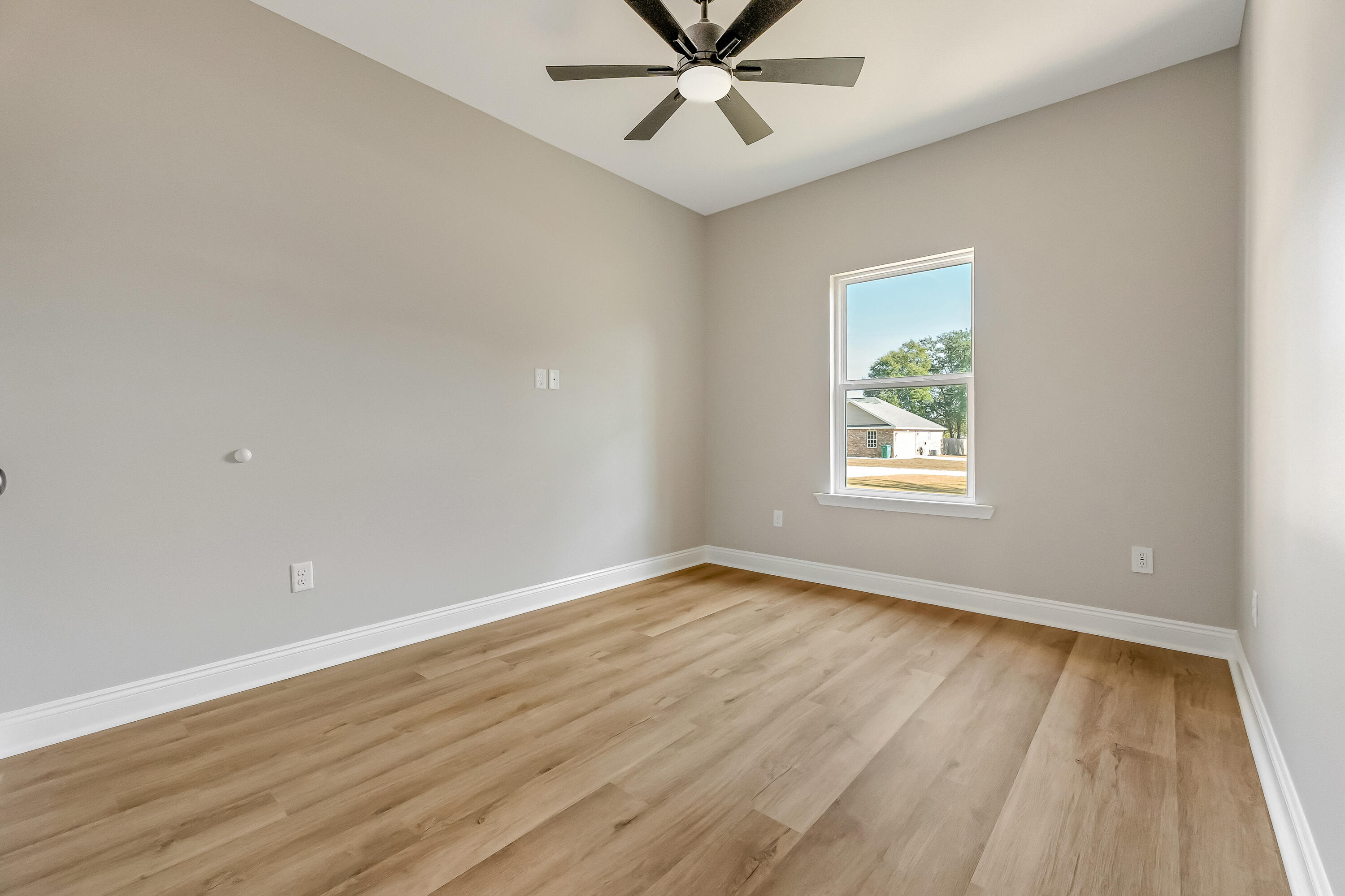 2.93-ac Goodwin Road Crestview, FL 32539 - Photo 36 of 45 wooden floor in an empty room with a window