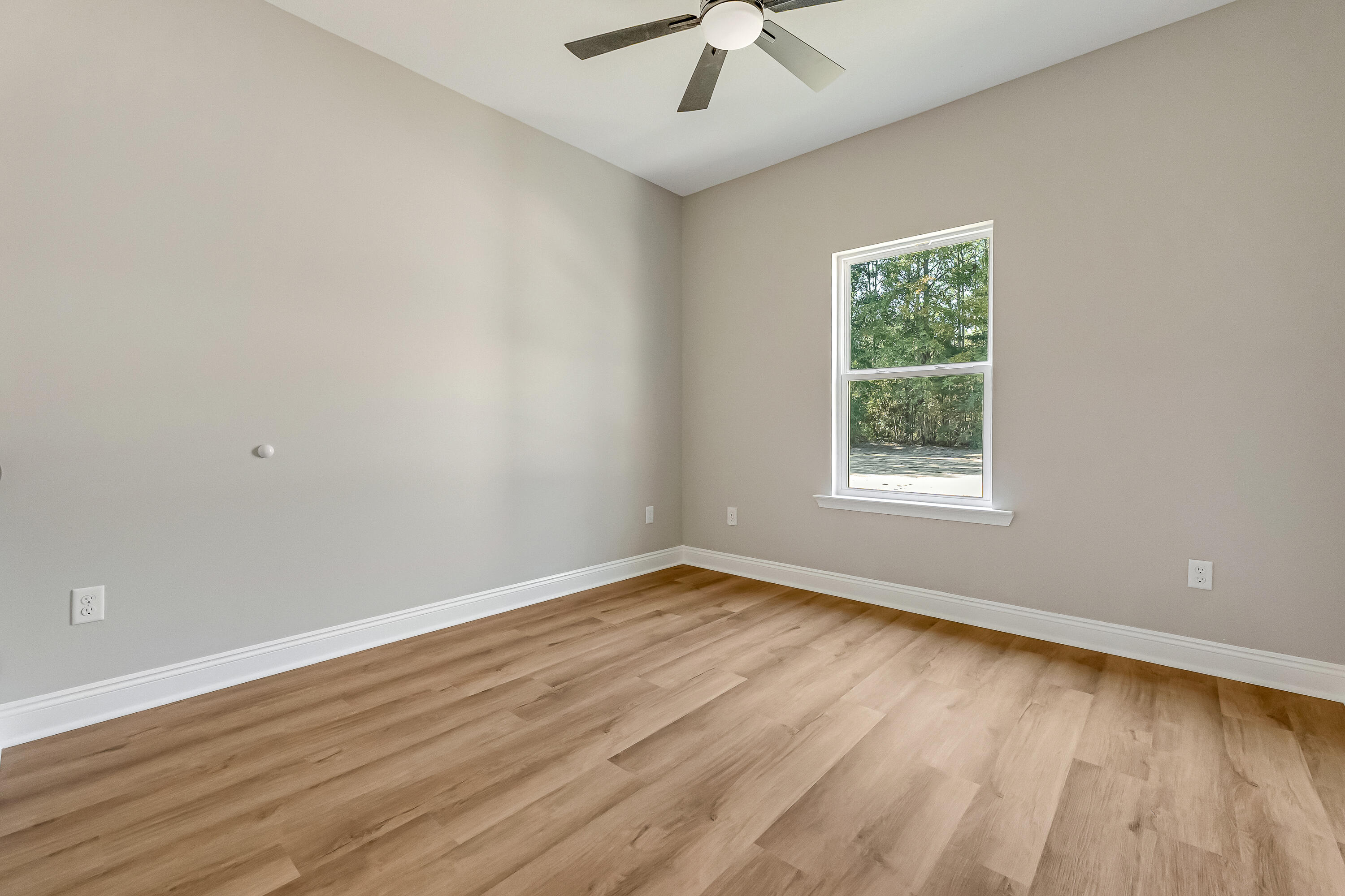 2.93-ac Goodwin Road Crestview, FL 32539 - Photo 40 of 45 an empty room with a window and a ceiling fan