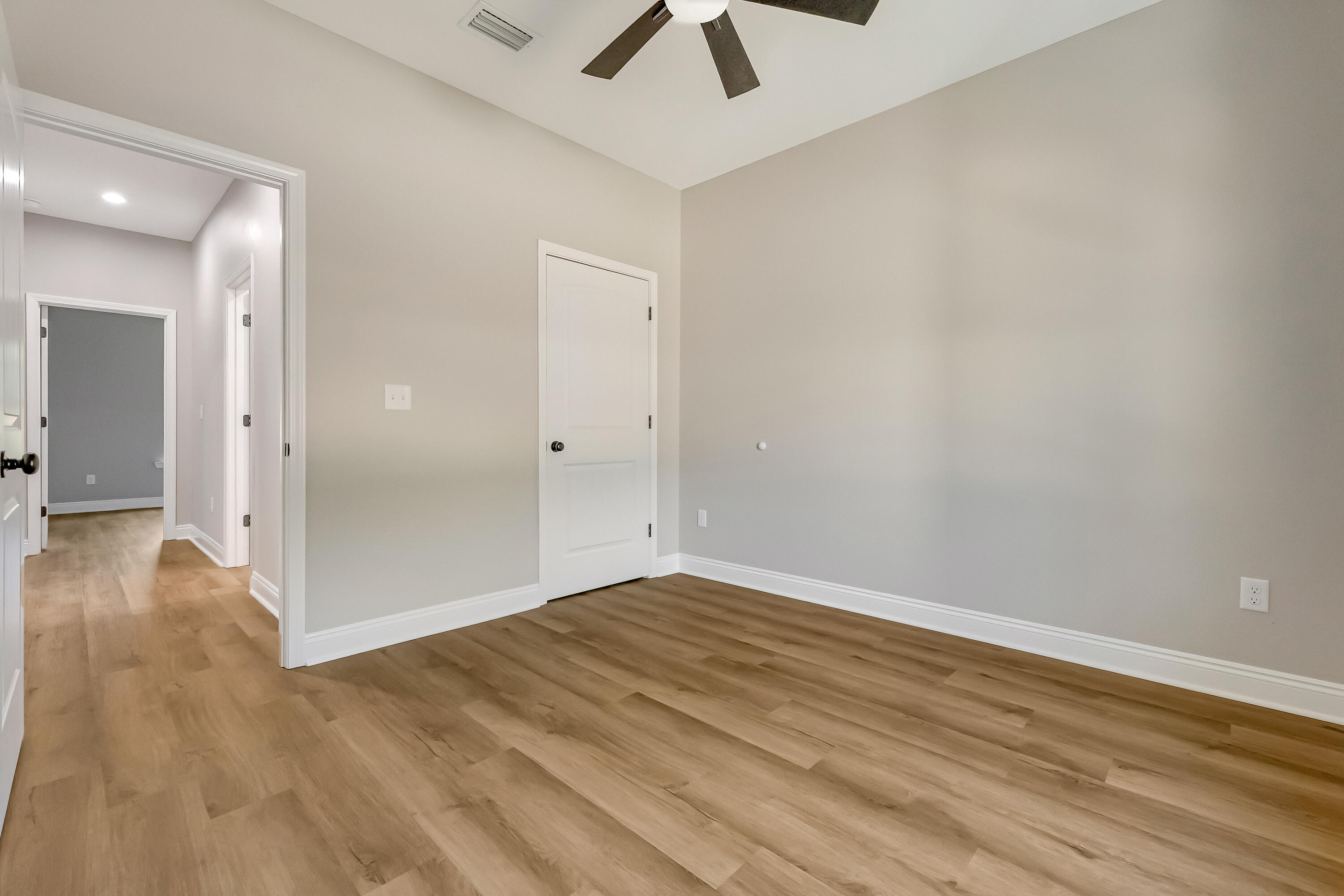 2.93-ac Goodwin Road Crestview, FL 32539 - Photo 41 of 45 an empty room with wooden floor and ceiling fan