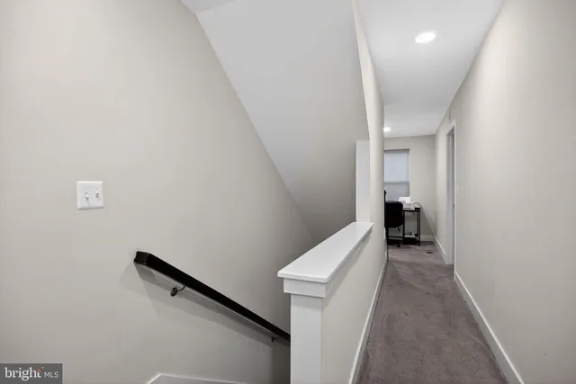 a view of a hallway with stairs