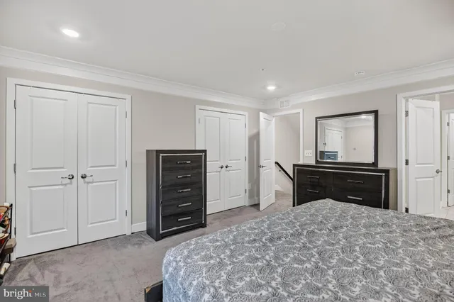 a bedroom with a bed and a television