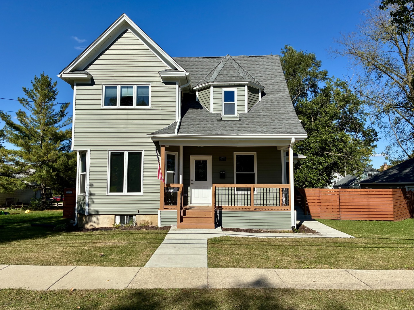 473 East Elm Street Sycamore, IL 60178 - Photo 1 of 21 a front view of a house with a yard