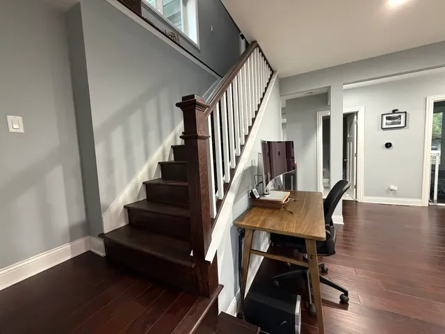 a view of a livingroom with furniture and wooden floor