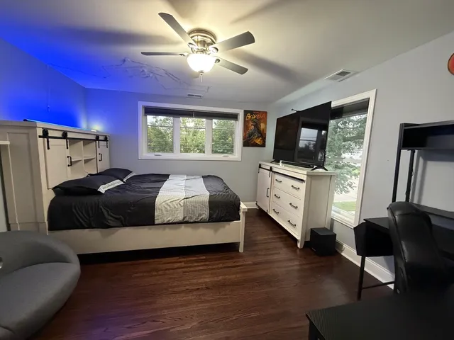 a living room with furniture fireplace and flat screen tv