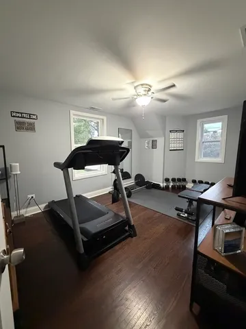 a bedroom with a bed and a night stand