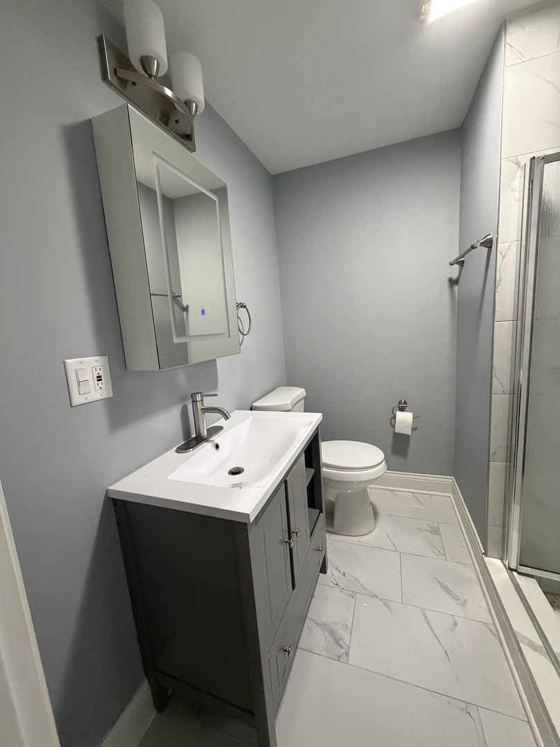 473 East Elm Street Sycamore, IL 60178 - Photo 18 of 21 a bathroom with a sink toilet and mirror