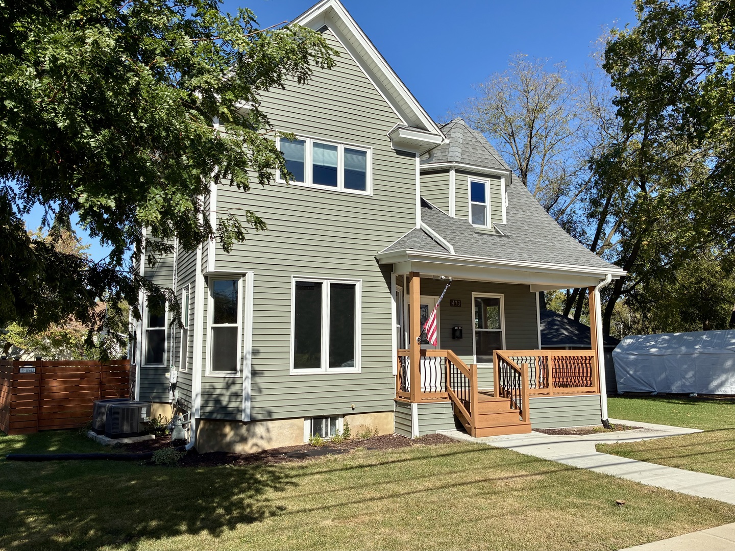 473 East Elm Street Sycamore, IL 60178 - Photo 3 of 21 a front view of a house with a yard