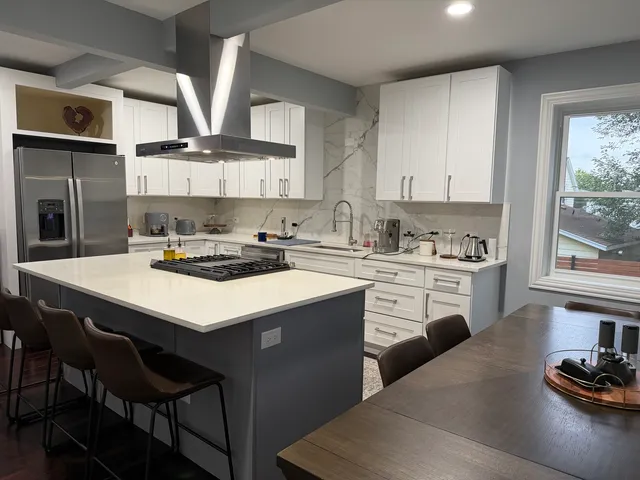 a kitchen with a sink cabinets and window