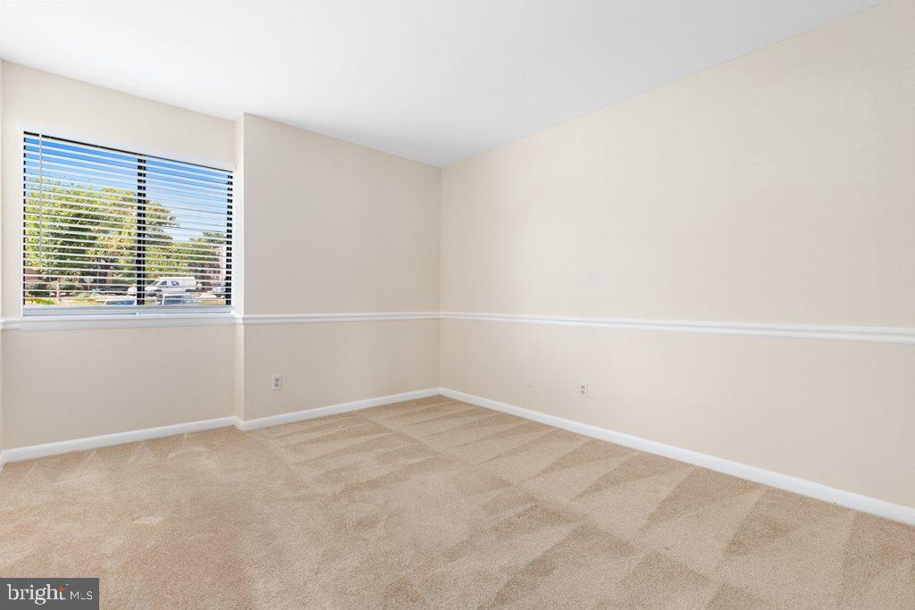 19027 Mills Choice Road, Unit 4 Gaithersburg, MD 20886 - Photo 14 of 26 a view of an empty room with a window