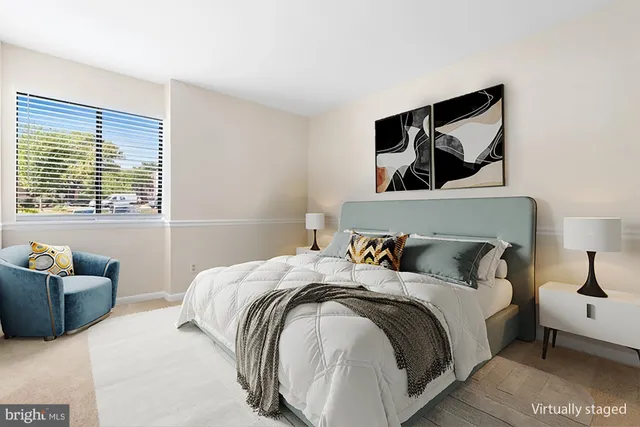 a bedroom with a bed and furniture with window