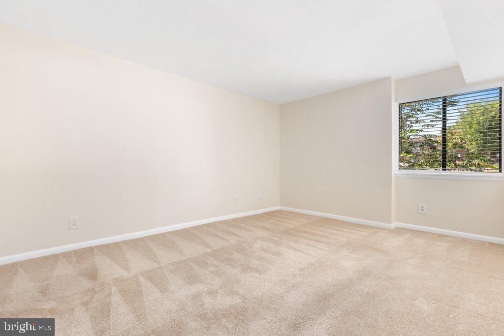 19027 Mills Choice Road, Unit 4 Gaithersburg, MD 20886 - Photo 17 of 26 an empty room with a window