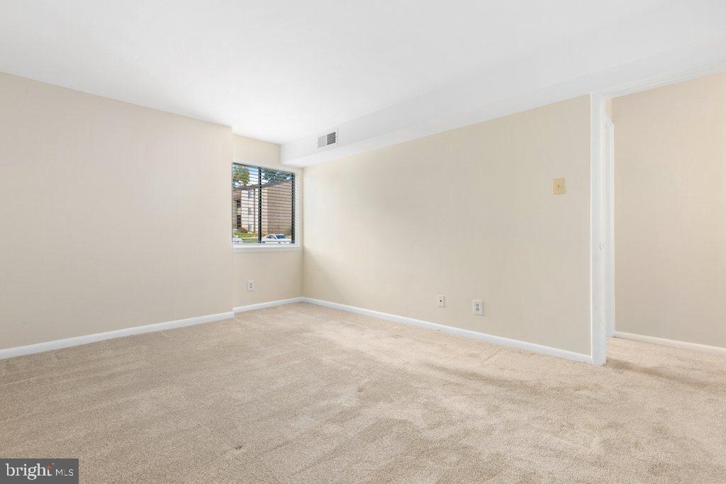 19027 Mills Choice Road, Unit 4 Gaithersburg, MD 20886 - Photo 19 of 26 an empty room with windows