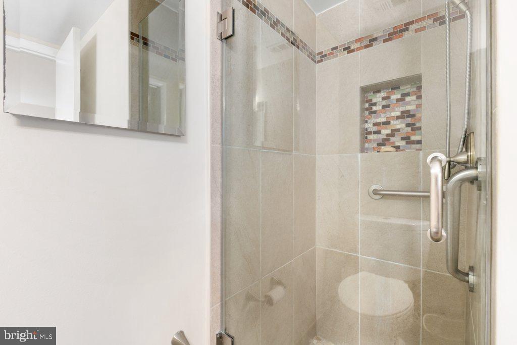 19027 Mills Choice Road, Unit 4 Gaithersburg, MD 20886 - Photo 22 of 26 a bathroom with a shower