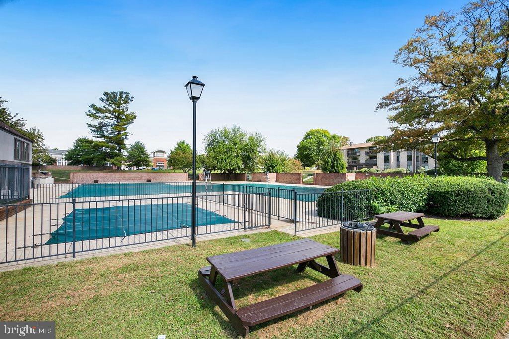 19027 Mills Choice Road, Unit 4 Gaithersburg, MD 20886 - Photo 25 of 26 a view of a patio with a table and chairs