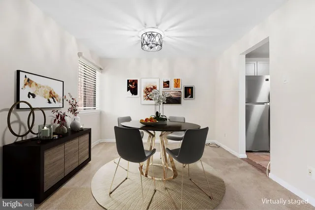 a dining room with furniture and wooden floor