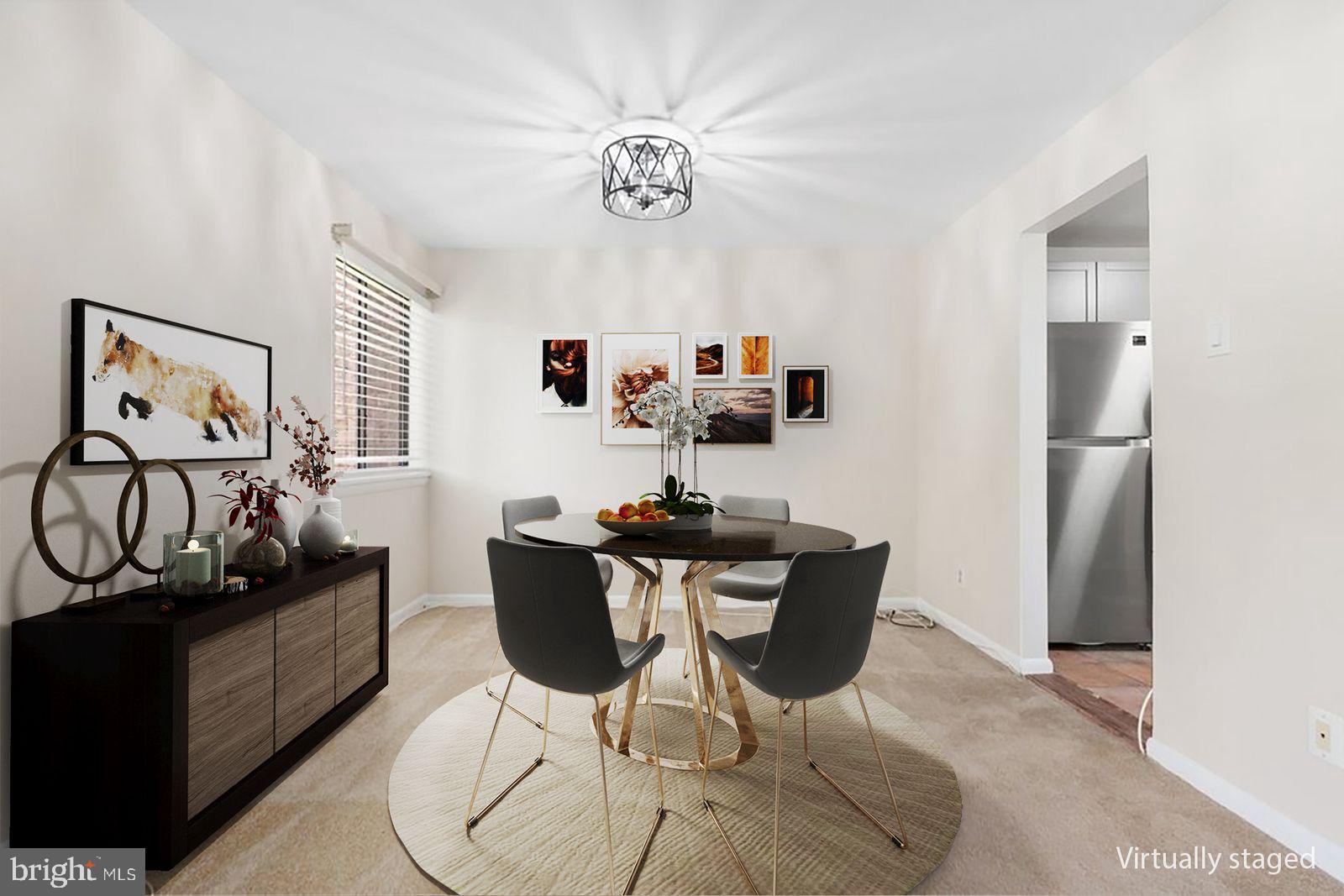 19027 Mills Choice Road, Unit 4 Gaithersburg, MD 20886 - Photo 8 of 26 a dining room with furniture and wooden floor