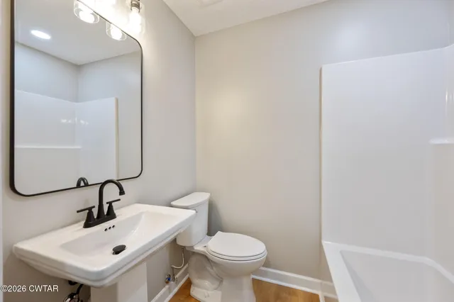 a bathroom with a sink and a toilet