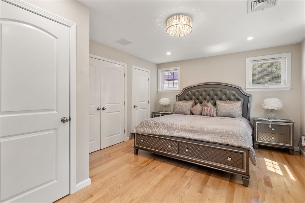 26 Brookview Lane, Unit 26 Mendon, MA 01756 - Photo 11 of 23 a bedroom with a bed and a window