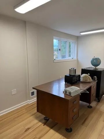 a workspace with furniture and window