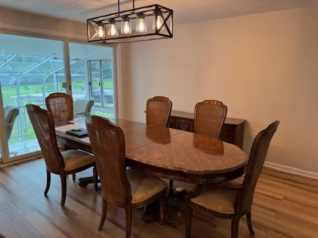 a view of a dining room with furniture window and outside view