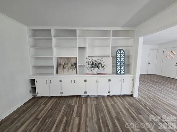 a view of cabinet and wooden floor