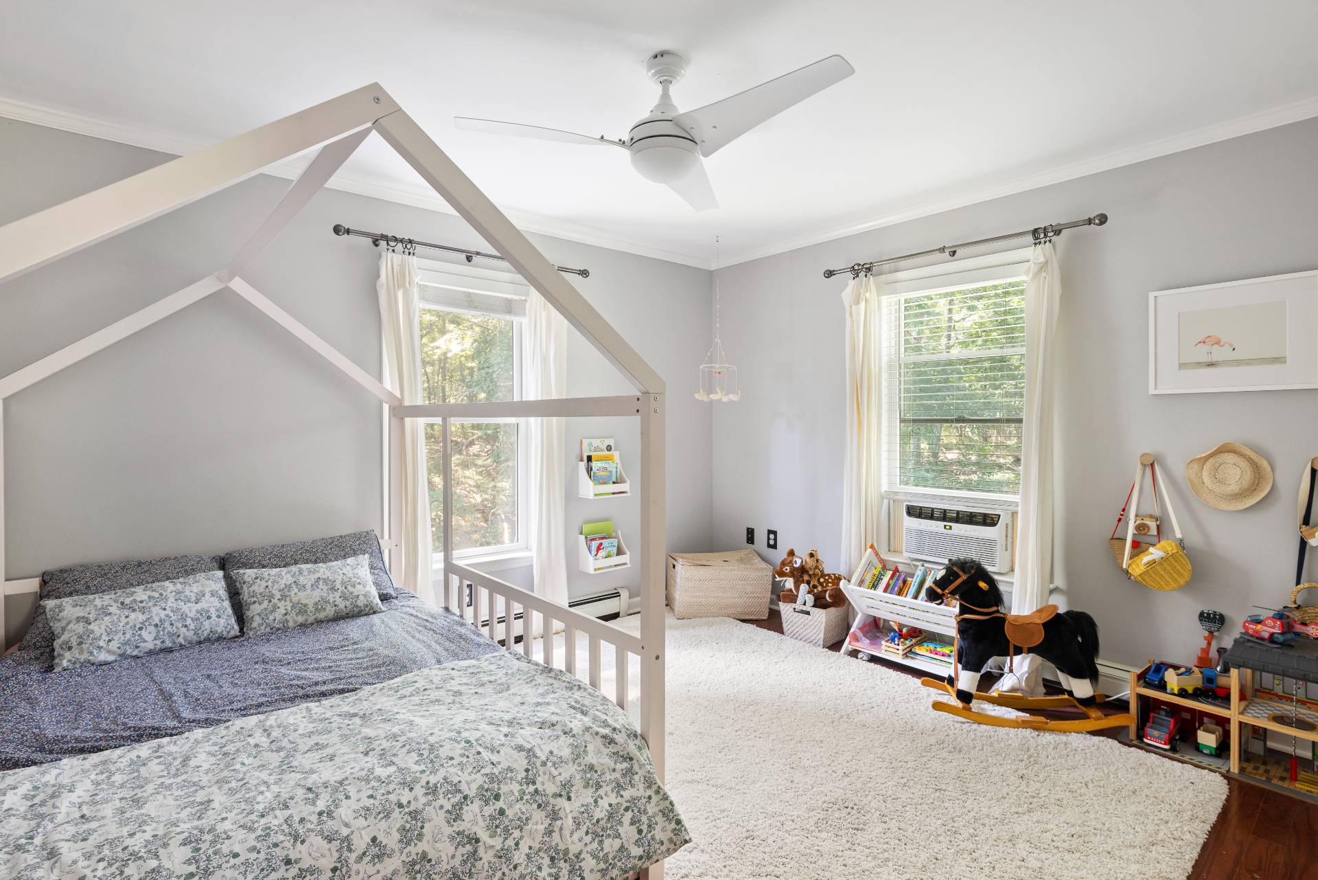 312 Noyack Road Southampton, NY 11968 - Photo 12 of 18 a living room with furniture gym equipment and a large window