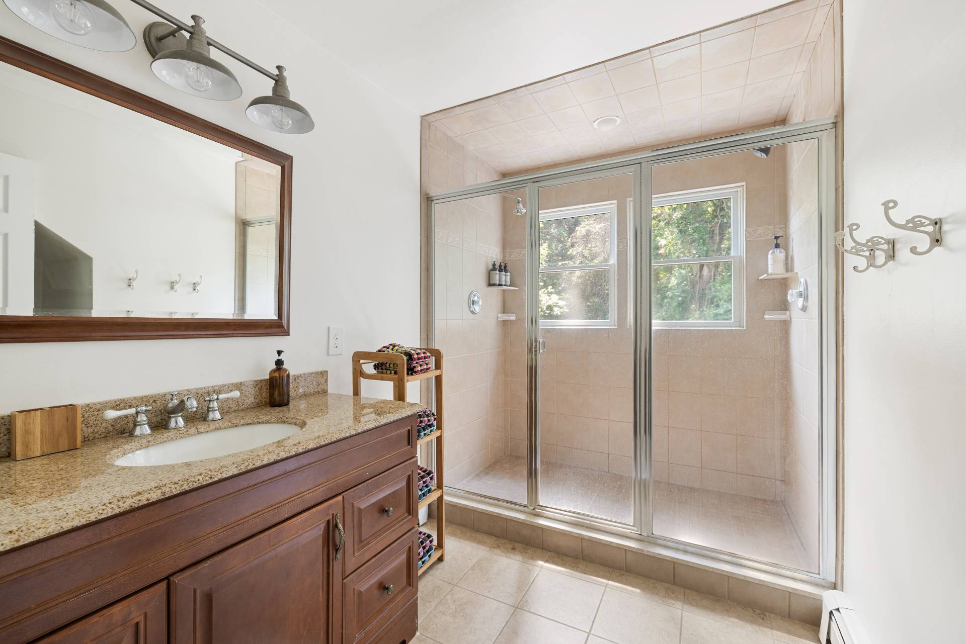 312 Noyack Road Southampton, NY 11968 - Photo 13 of 18 a bathroom with a granite countertop sink mirror and double